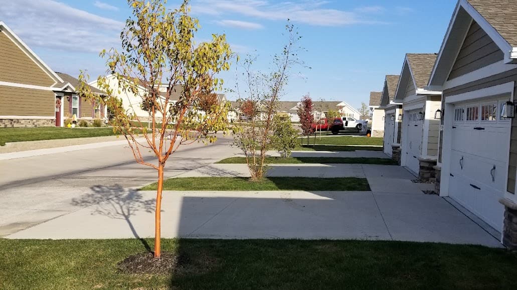Front lawn and landscaped beds beside a home